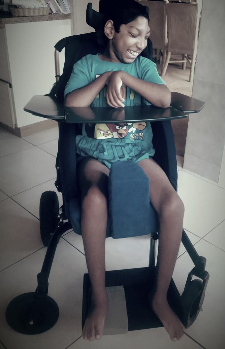 Jaden sitting in his supportive chair