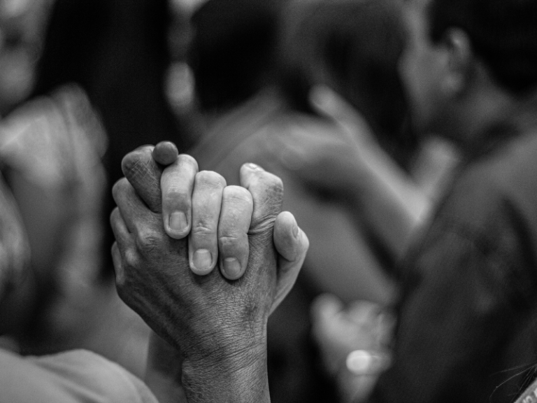 A black and white pic depicting a hand being held trustingly