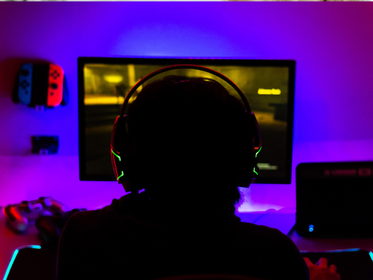 Teen boy playing online games while balancing school and family life