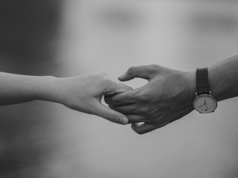Couple holding hands