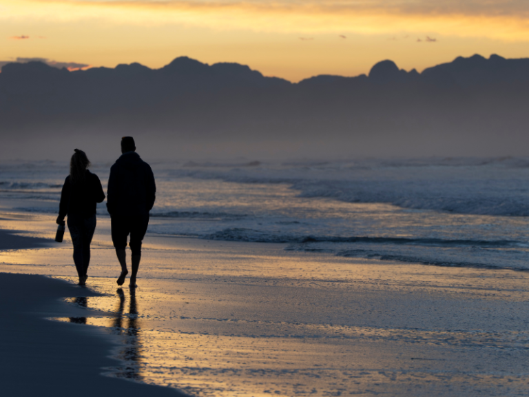 Couple walking together outdoors and talking