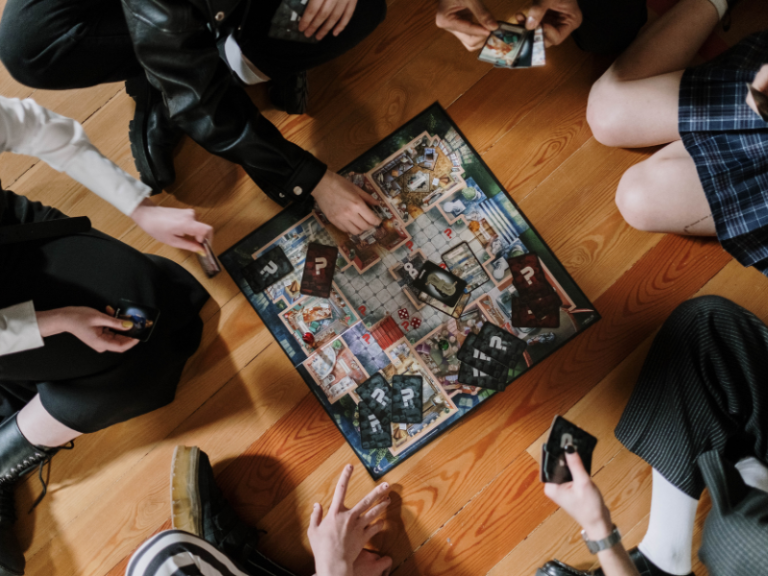 Family playing a board game together in the living room