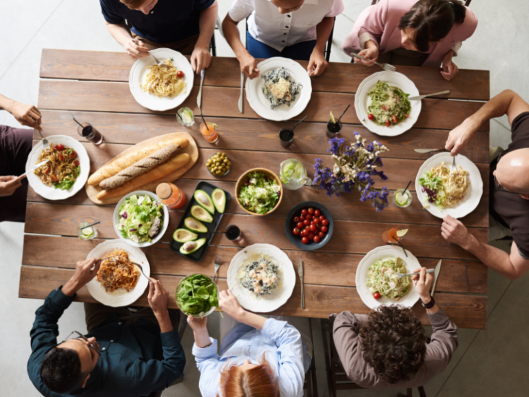 Family sharing a meal around a dining table